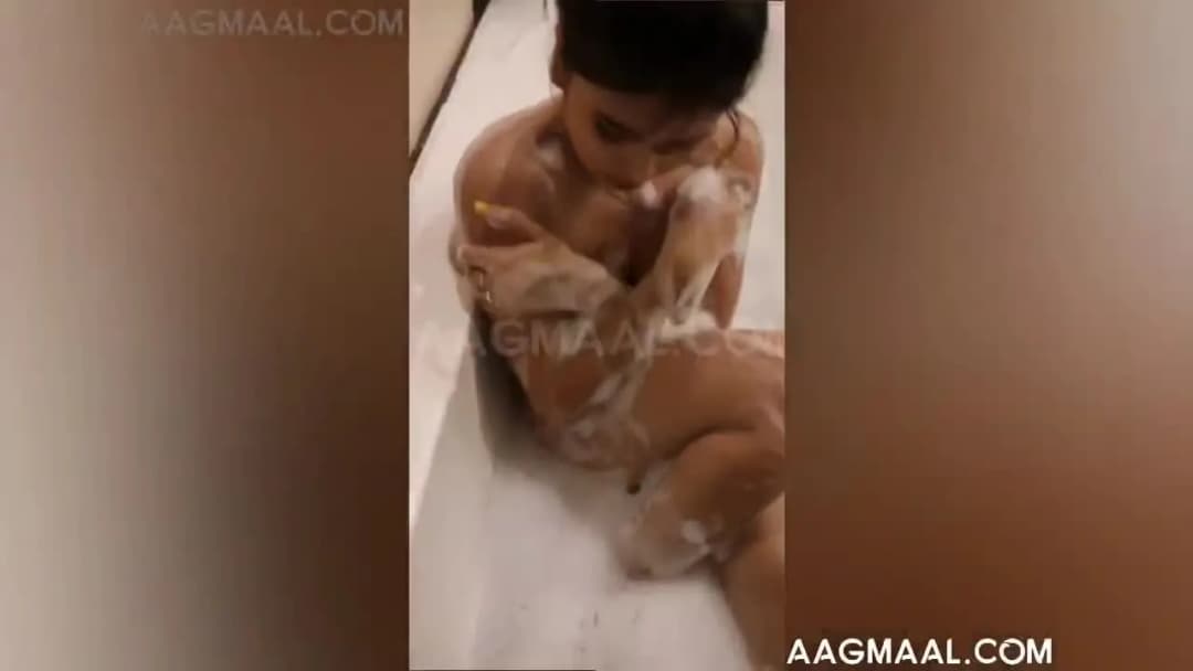 Indian girl taking a bath in the bathroom 